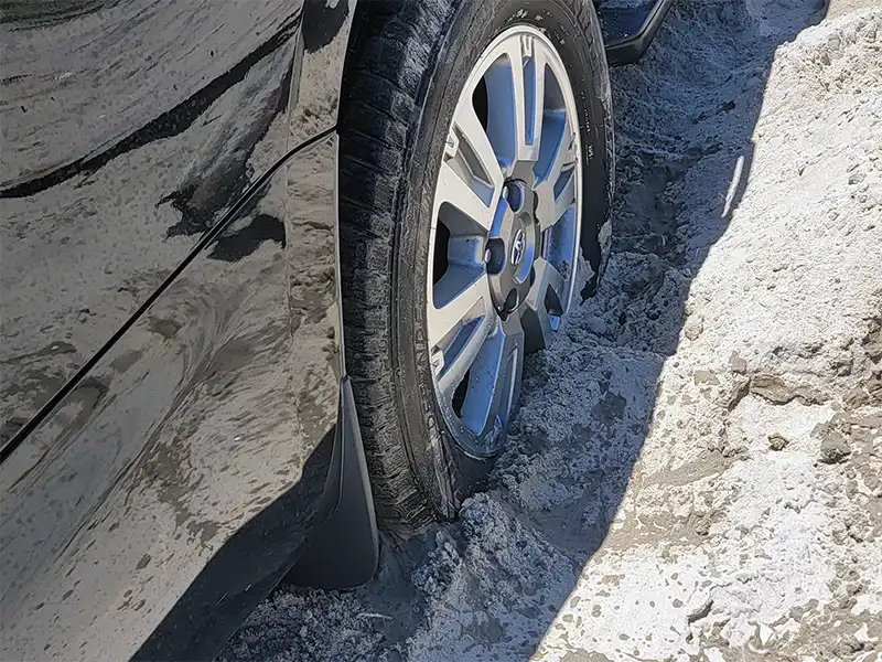 Photo of a tire stuck in the sand at Boca Chica Beach in Texas