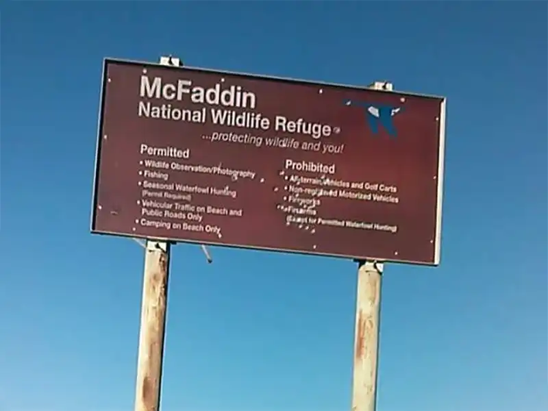 Photo of the sign at mcfaddin national wildlife refuge beach camping